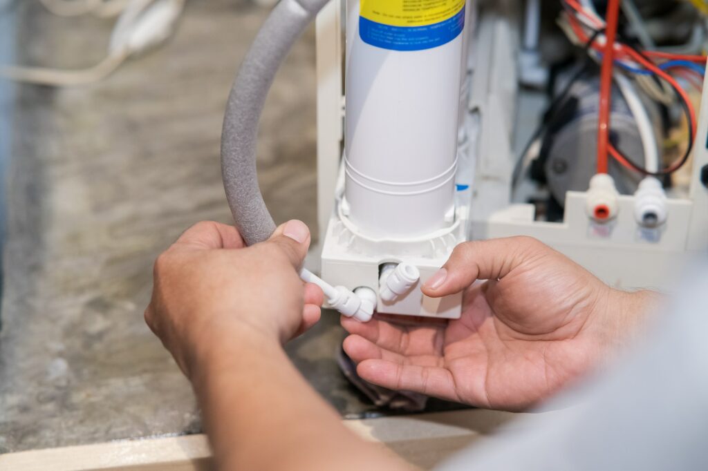 Changing water filter at home.